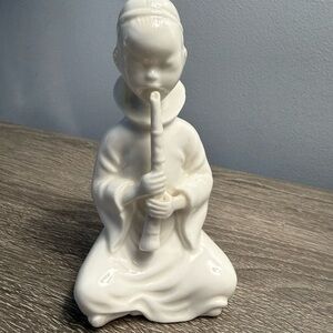 "Blanc de Chine" boy flute player